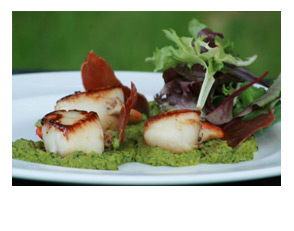 Seared Lyme Bay scallops with pea and mint pur�e and oven-dried Prosciutto